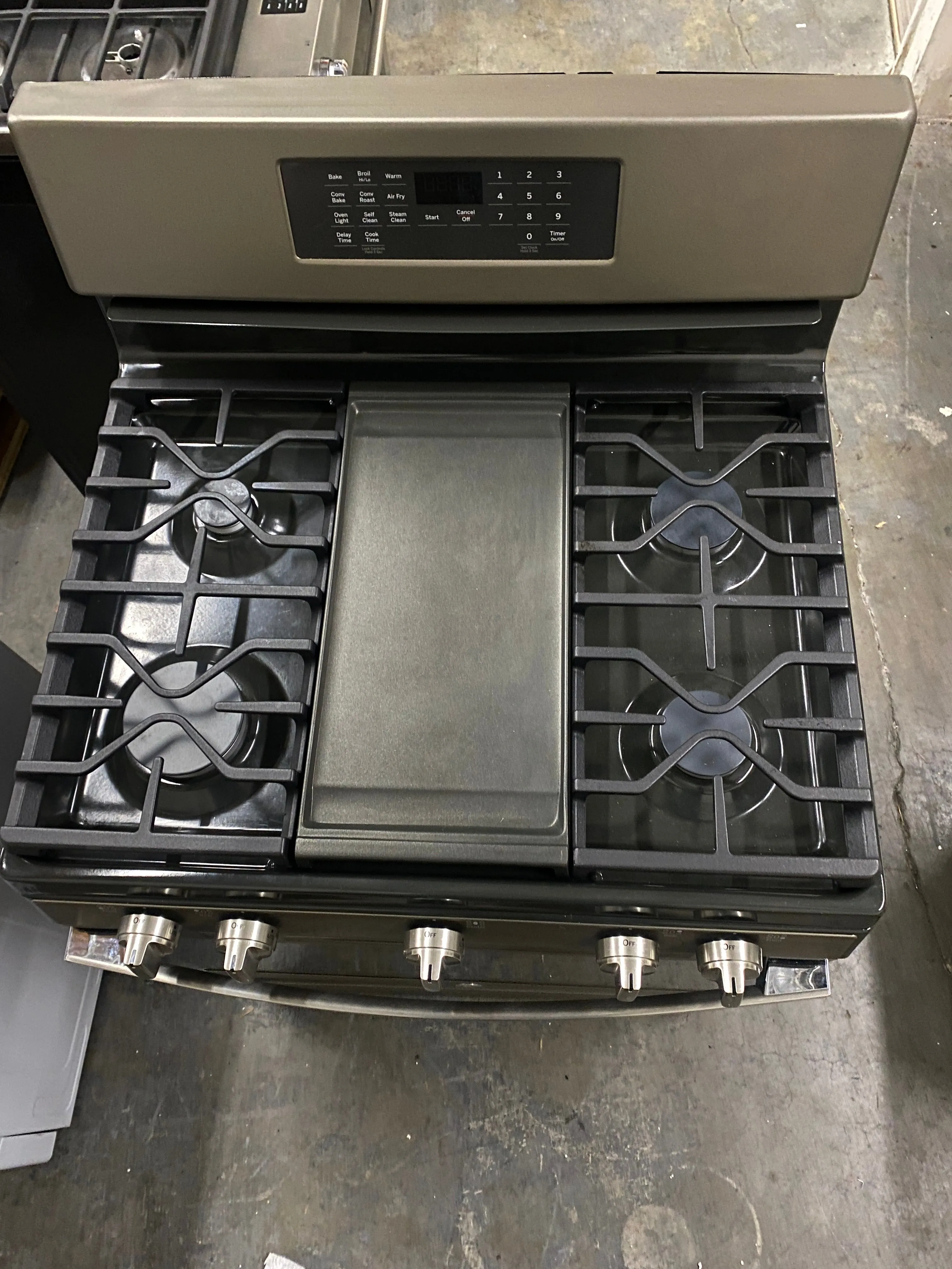 GE JGB735EPES 30 Inch Freestanding Gas Convection Range with 5 Sealed Burners, 5 Cu. Ft. Oven Capacity, Storage Drawer, Edge-to-Edge Cooktop, Self-Clean Steam Clean, Integrated Griddle, and Center Oval Burner: Fingerprint Resistant Slate