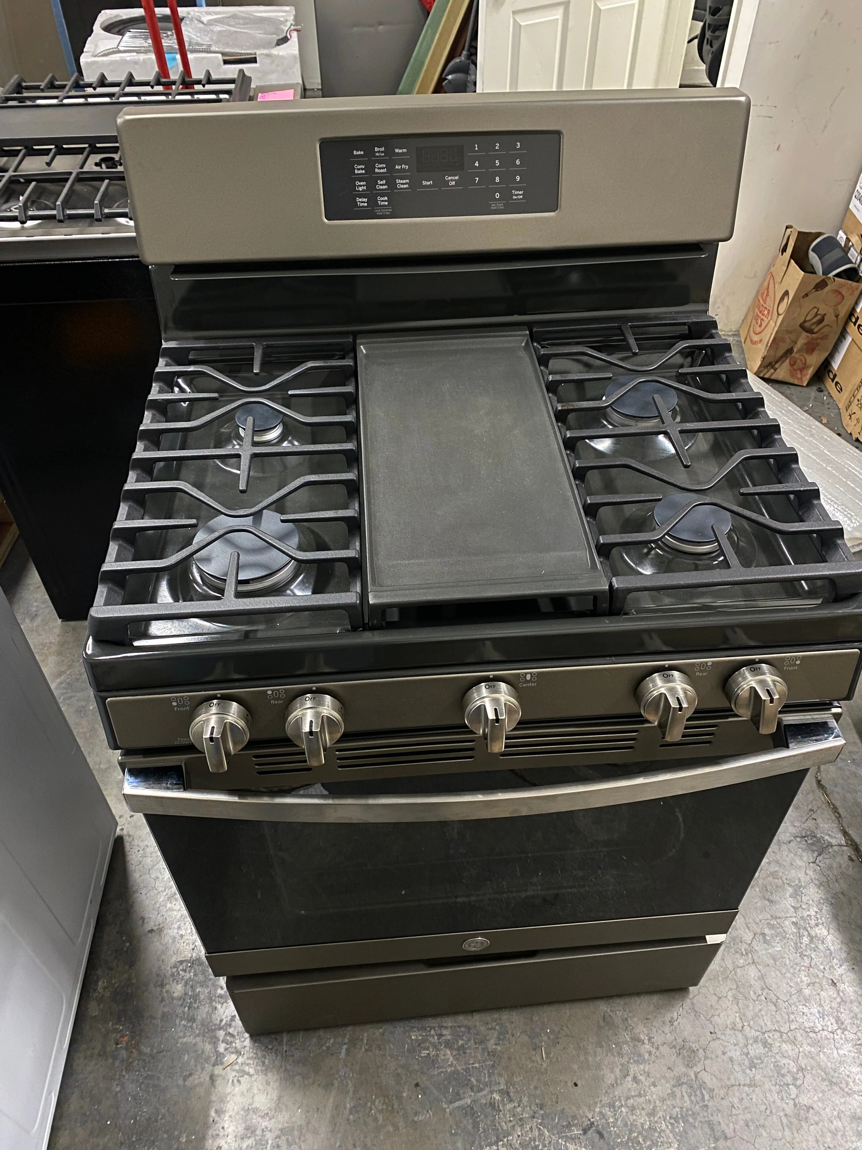 GE JGB735EPES 30 Inch Freestanding Gas Convection Range with 5 Sealed Burners, 5 Cu. Ft. Oven Capacity, Storage Drawer, Edge-to-Edge Cooktop, Self-Clean Steam Clean, Integrated Griddle, and Center Oval Burner: Fingerprint Resistant Slate